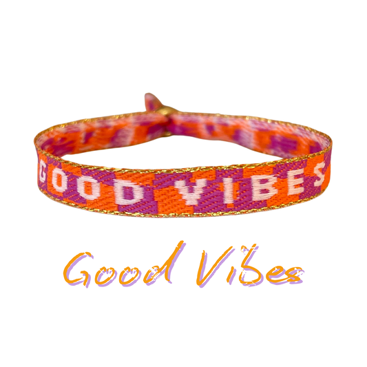 Colorful "Good Vibes" statement armband in orange and purple.