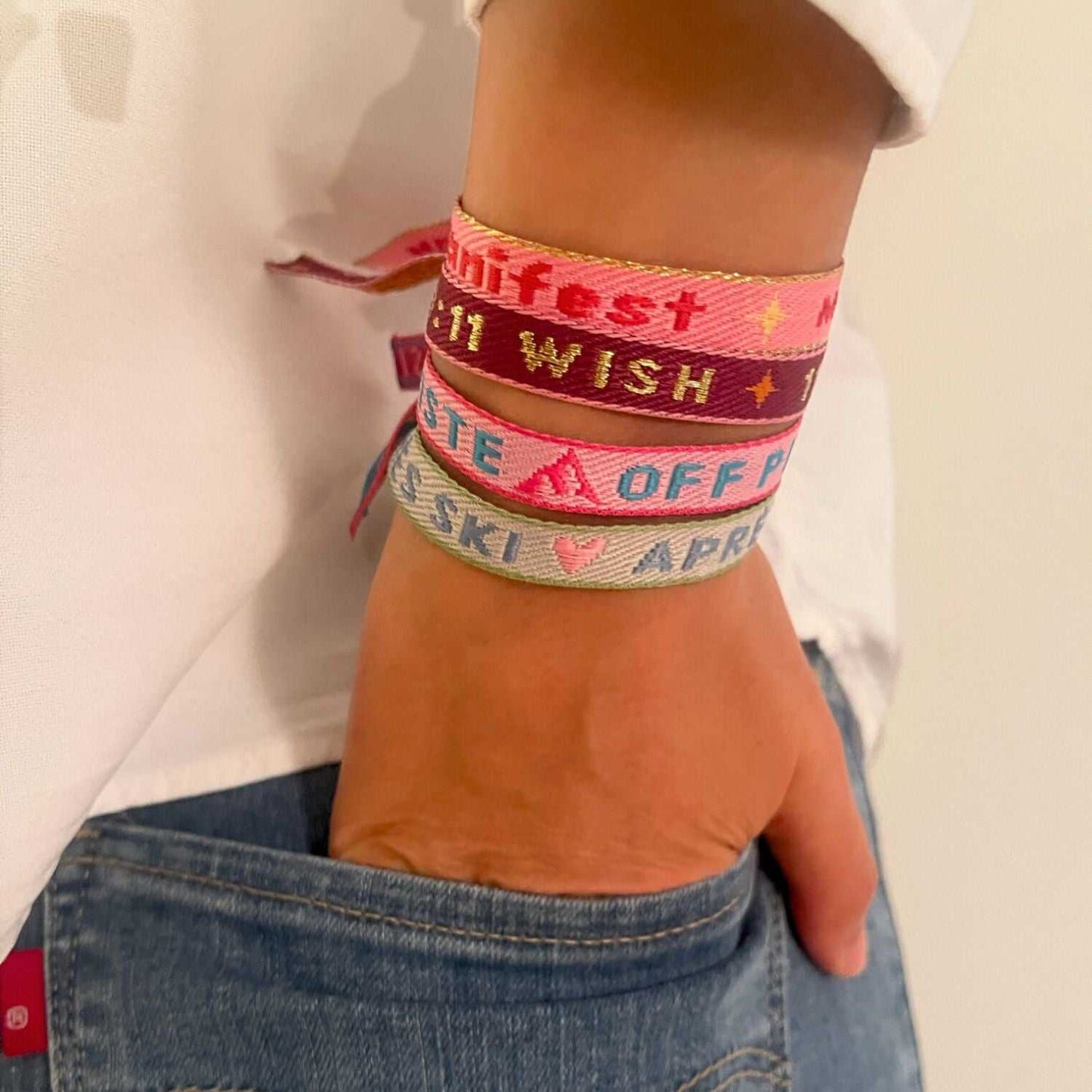 Colorful statement armband on wrist, featuring adjustable straps for adventure and freedom.