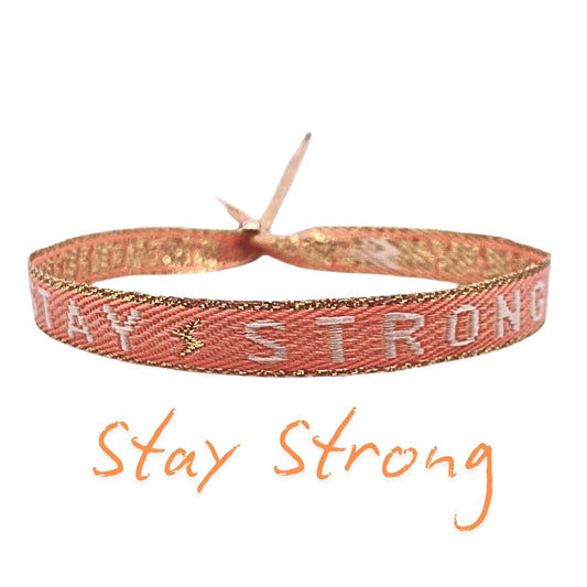Statement Armband „Stay Strong“ in Orange mit verstellbarer Schiebeperle, inspiriert von Stärke und Durchhaltevermögen.